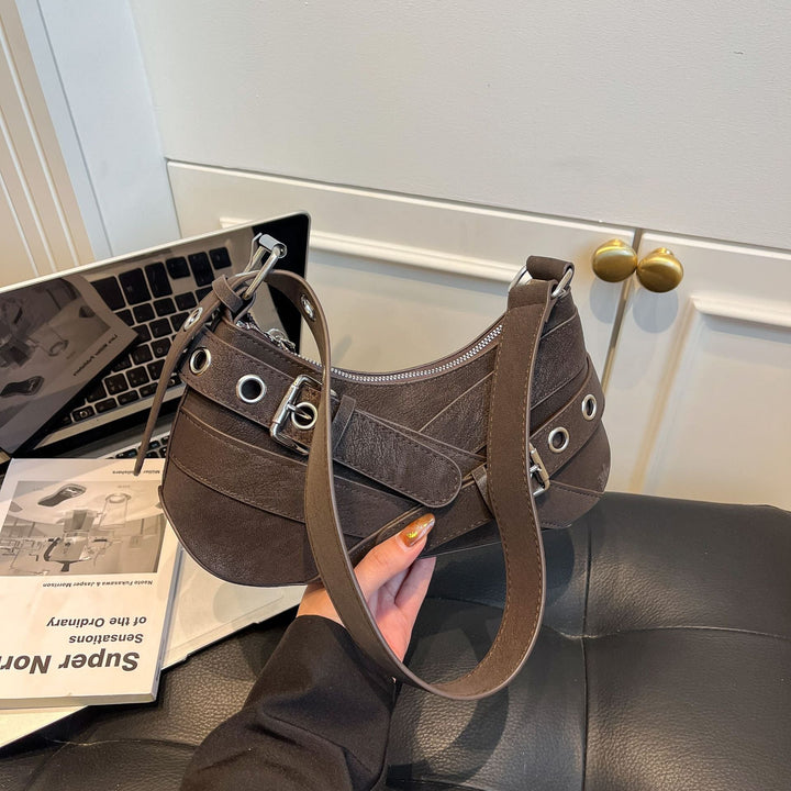 Women's fashionable shoulder bag made of soft suede leather with unique appliqué