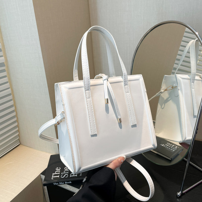 Women's elegant handbag in minimalist design with detachable shoulder strap