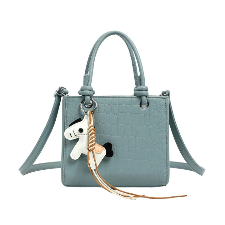 Women's mini bag with animal charm and modern crocodile look