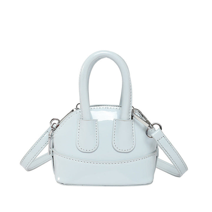 Ladies mini handbag with elegant glossy finish and removable shoulder strap