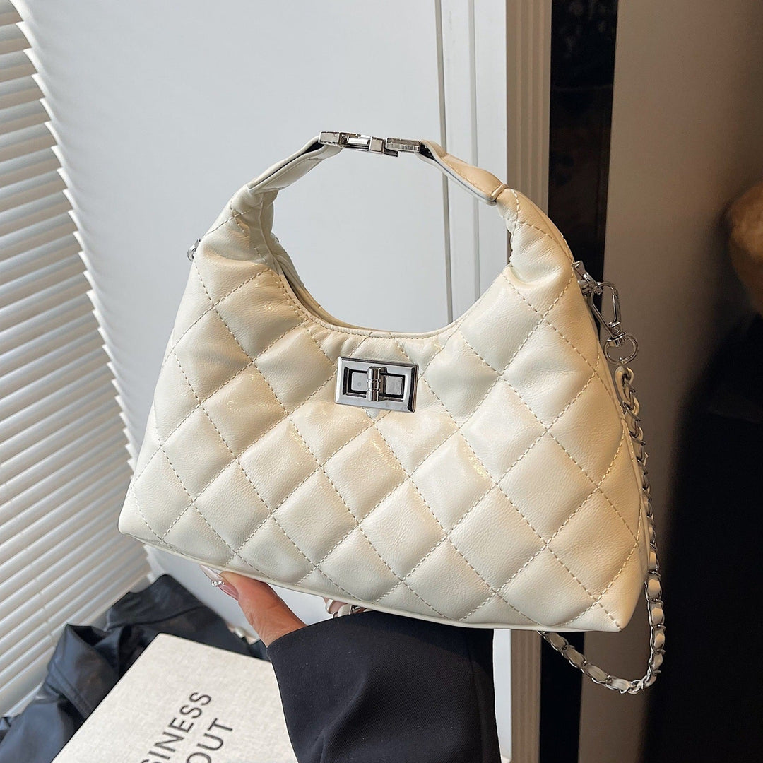 Women's mini bag with elegant quilted design and chic chain closure