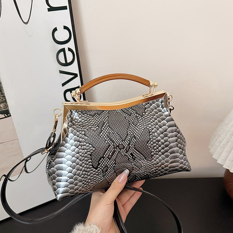 Ladies elegant tote bag in stylish snake leather look