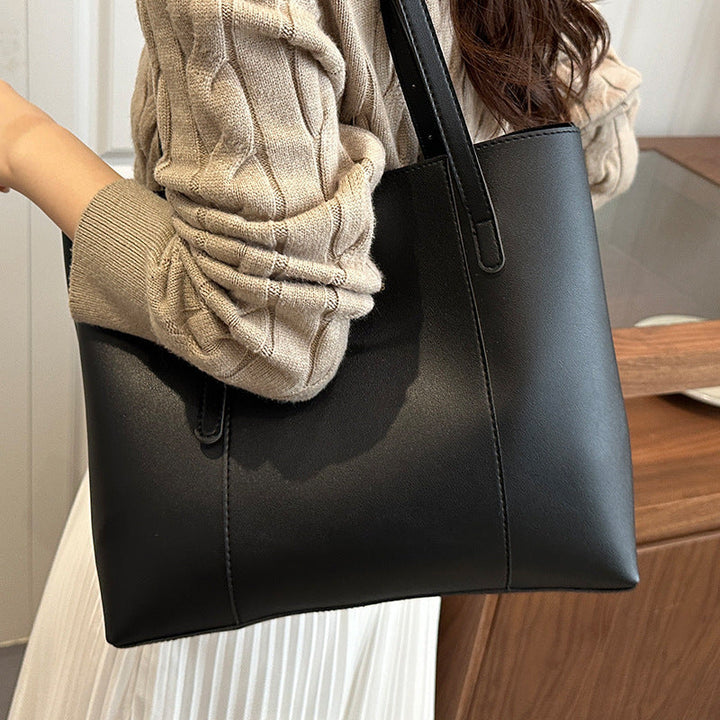 Women's elegant tote bag made of high-quality faux leather with distinctive design