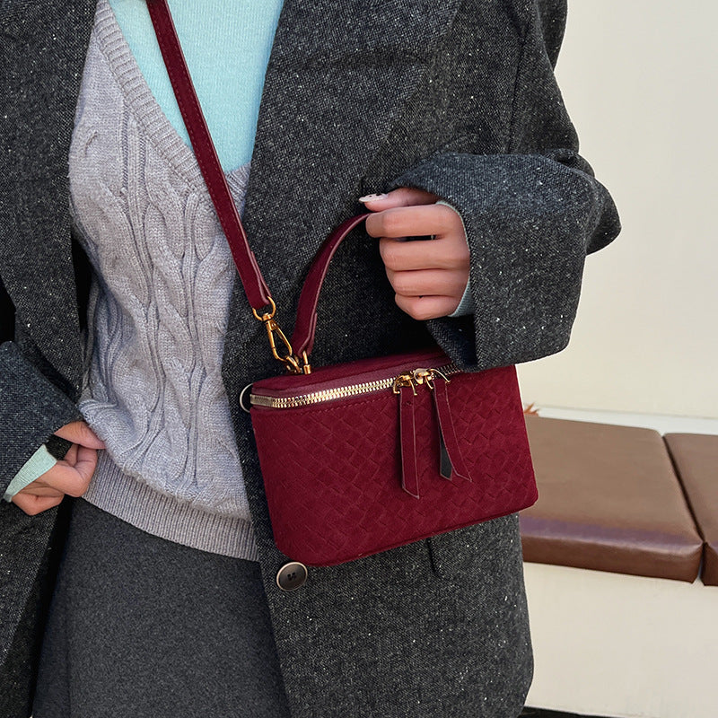 Women's structured shoulder bag with detachable carrying strap
