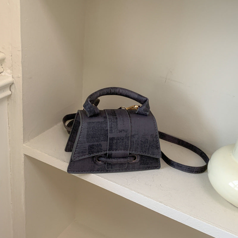 Women's elegant mini handbag with textured design