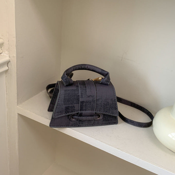 Women's elegant mini handbag with textured design