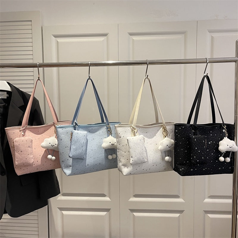 Women's large tote bag with sparkling star design and detachable cosmetic pouch