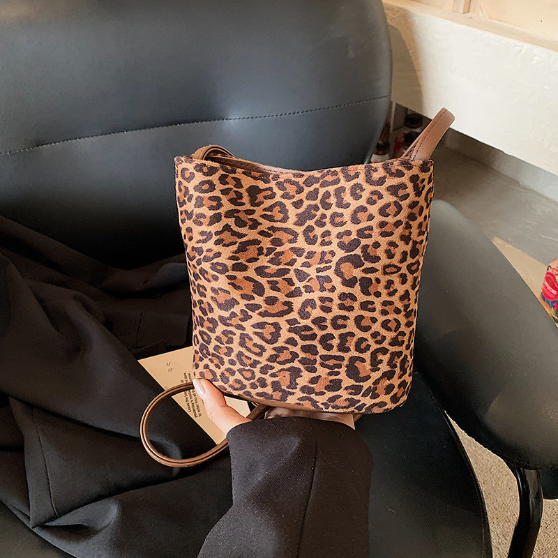 Women's mini bag made of soft suede with adjustable shoulder strap