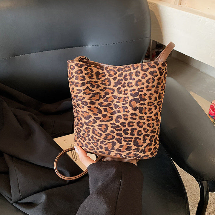Women's mini bag made of soft suede with adjustable shoulder strap
