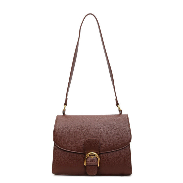 Ladies shoulder bag with elegant flap closure and decorative metal accent