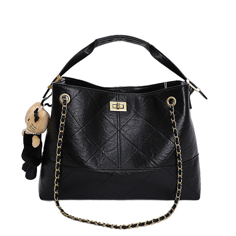 Women's shoulder bag with elegant chain accent and cute pendant