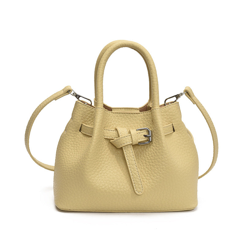Women's mini handbag with stylish button closure