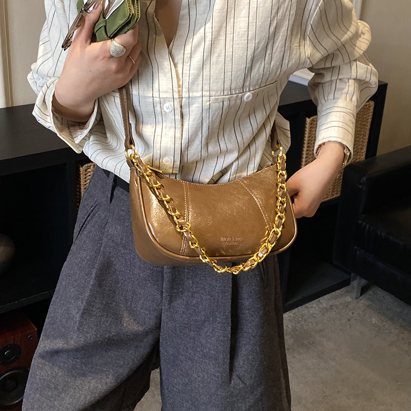 Women's shoulder bag with elegant chain accent