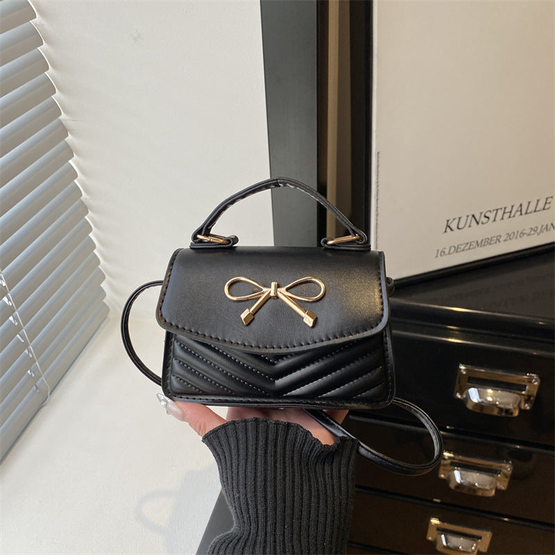 Women’s mini handbag with elegant bow decoration