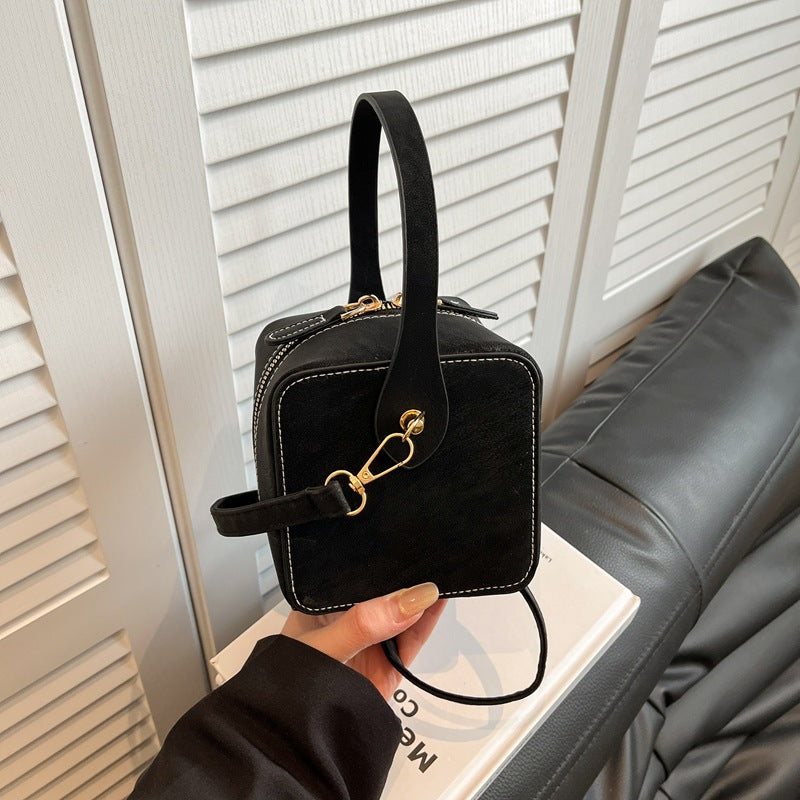 Ladies mini handbag with removable shoulder strap and elegant flap closure