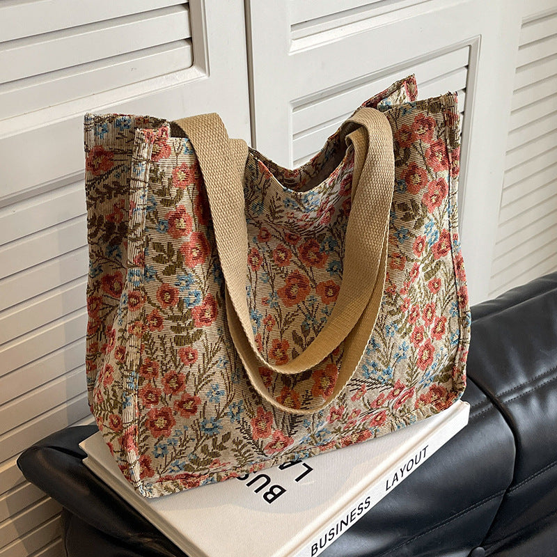 Women's tote bag with floral embroidery design and sturdy handles
