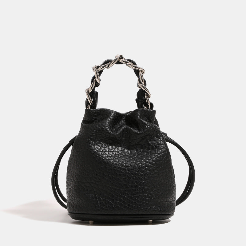 Women's mini backpack bag with elegant chain handle and fine texture