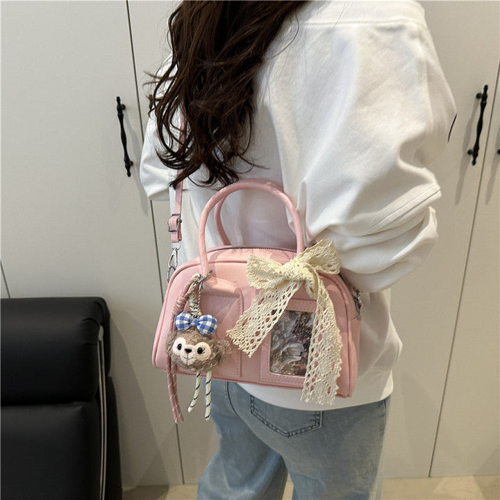 Ladies Mini Handbag with playful animal motif and charming charm