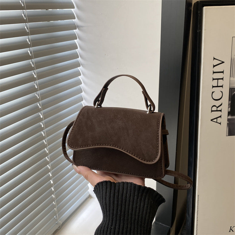Women's mini handbag with removable carry handle