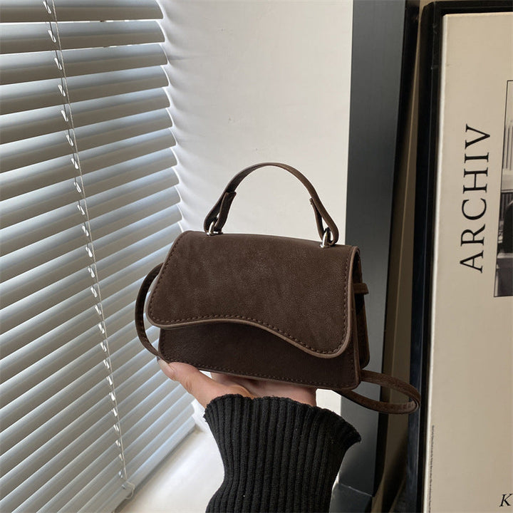 Women's mini handbag with removable carry handle