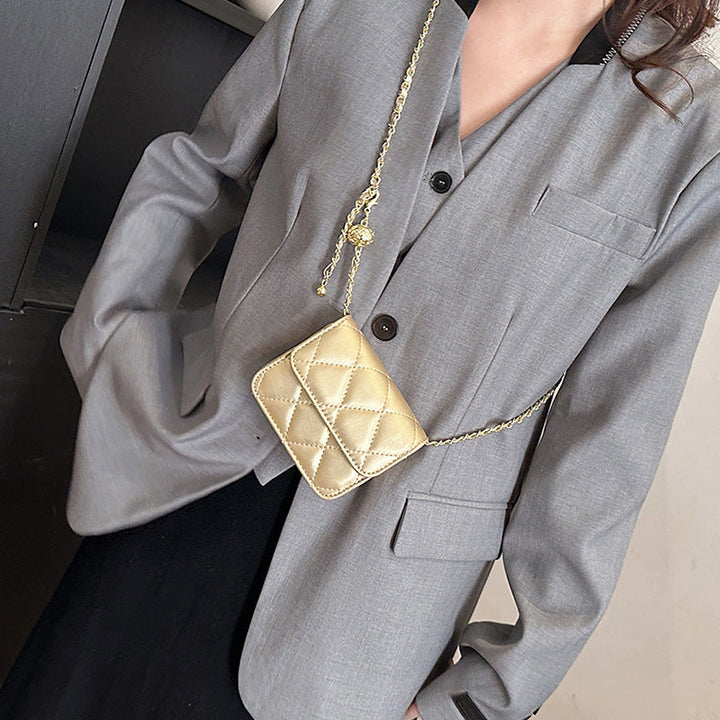 Women's mini crossbody bag with shiny chain and charming pendant