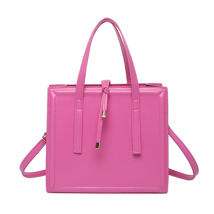 Women's elegant handbag in minimalist design with detachable shoulder strap