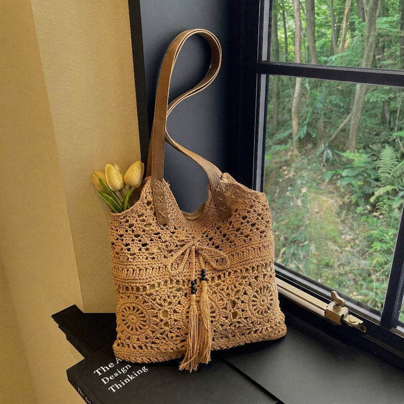 Ladies' crochet shoulder bag with playful fringes and decorative details