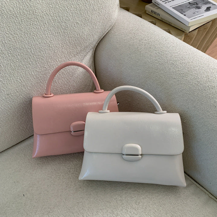 Women's handbag with textured design and elegant closure