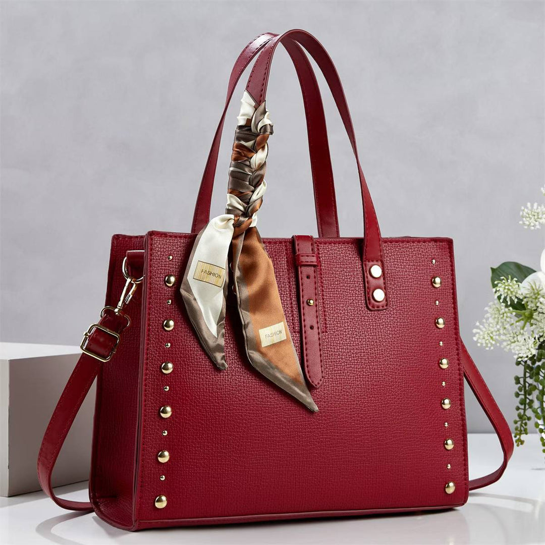 Ladies elegant tote bag with golden studs and fashionable scarf