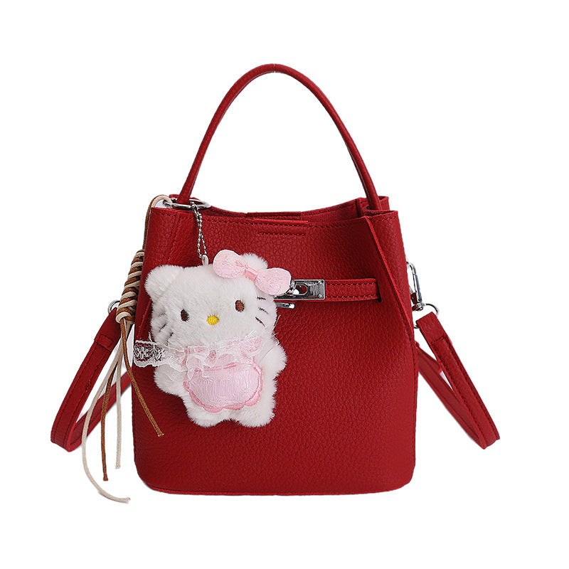Women's mini handbag with cute charm