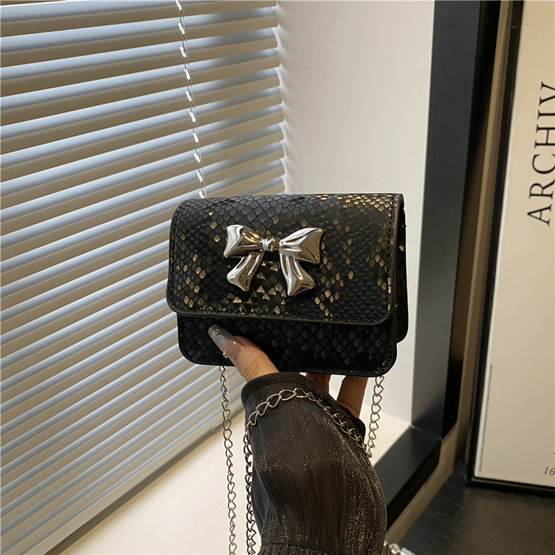 Women's clutch with playful bow design