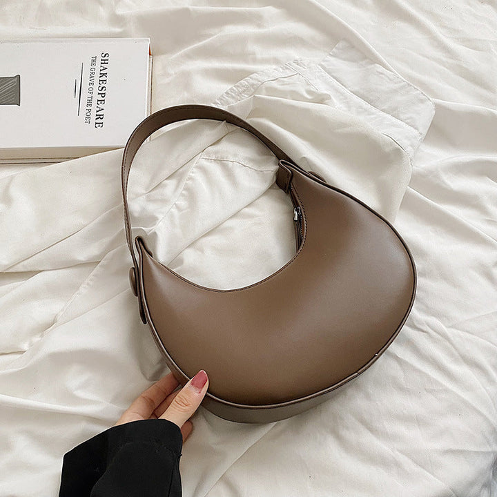 Women elegant shoulder bag with modern accents