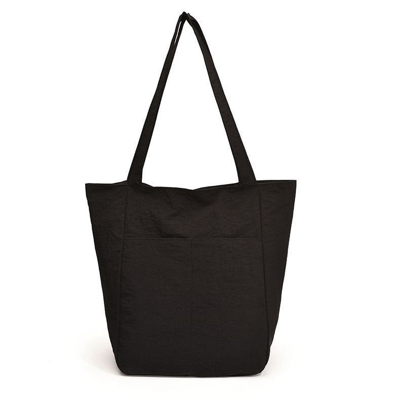 Women's casual tote bag with spacious design and practical inner pockets