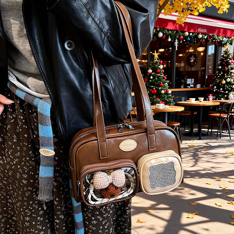 Women's shoulder bag with unique drawstring and charming pendant