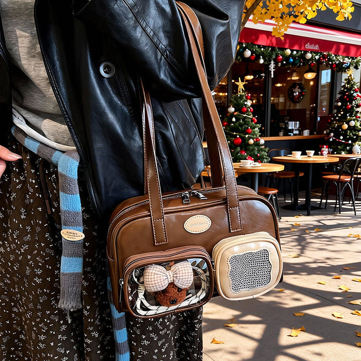 Women's shoulder bag with unique drawstring and charming pendant