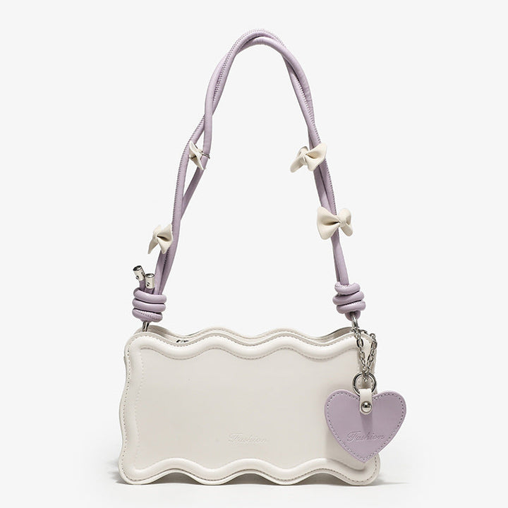 Ladies mini handbag with creative wave pattern and playful pendant