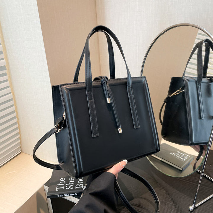Women's elegant handbag in minimalist design with detachable shoulder strap
