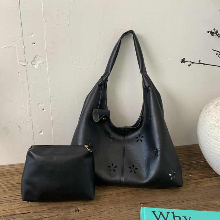 Women's hobo bag with floral design and practical mini organizer