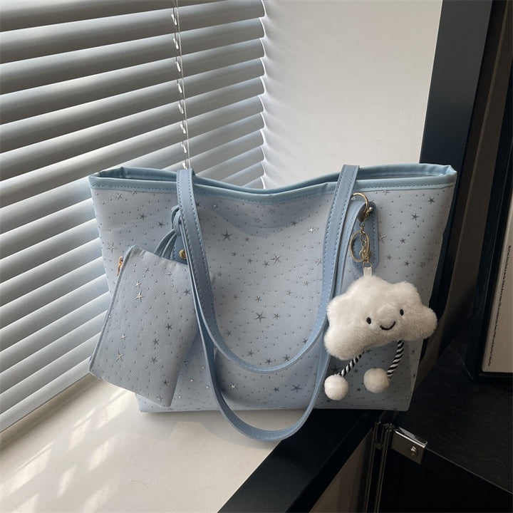 Women's large tote bag with sparkling star design and detachable cosmetic pouch