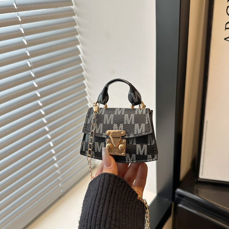 Women's mini handbag with decorative chain strap