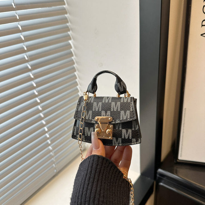 Women's mini handbag with decorative chain strap
