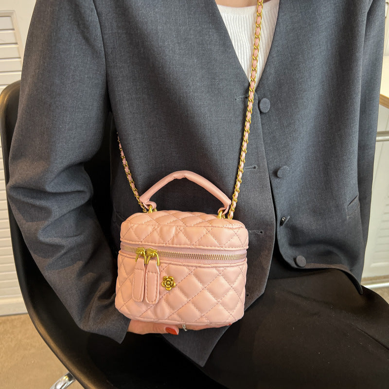 Women's mini bag in elegant quilted design with golden accents