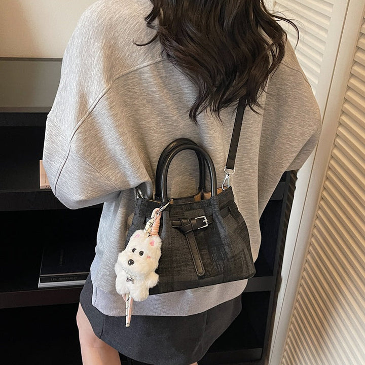 Women’s mini handbag with modern accents and practical interior organizer