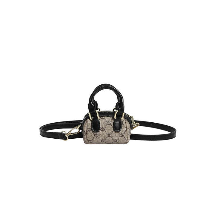 Ladies mini handbag with luxurious accents and adjustable shoulder strap