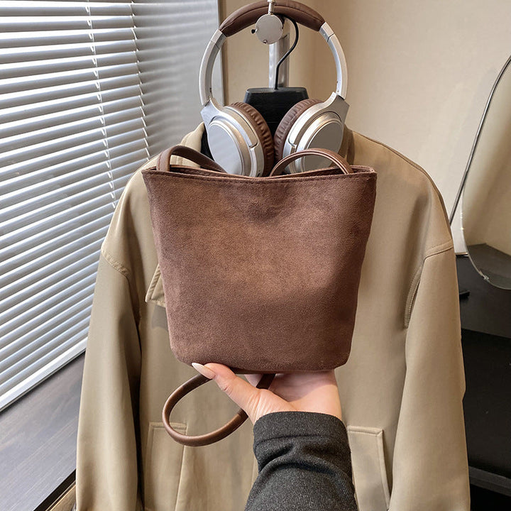 Women's mini bag made of soft suede with adjustable shoulder strap