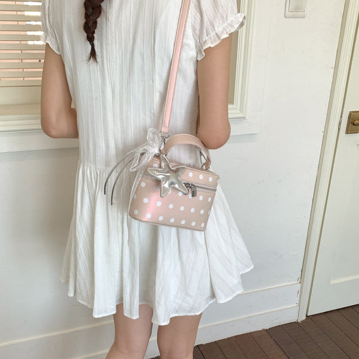 Women's mini handbag with playful design and elegant accents