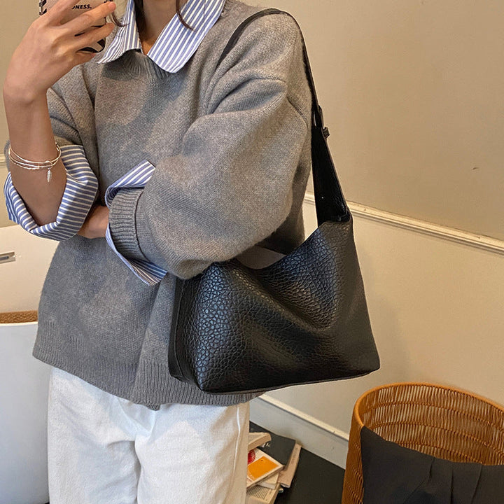 Women stylish shoulder bag with textured design