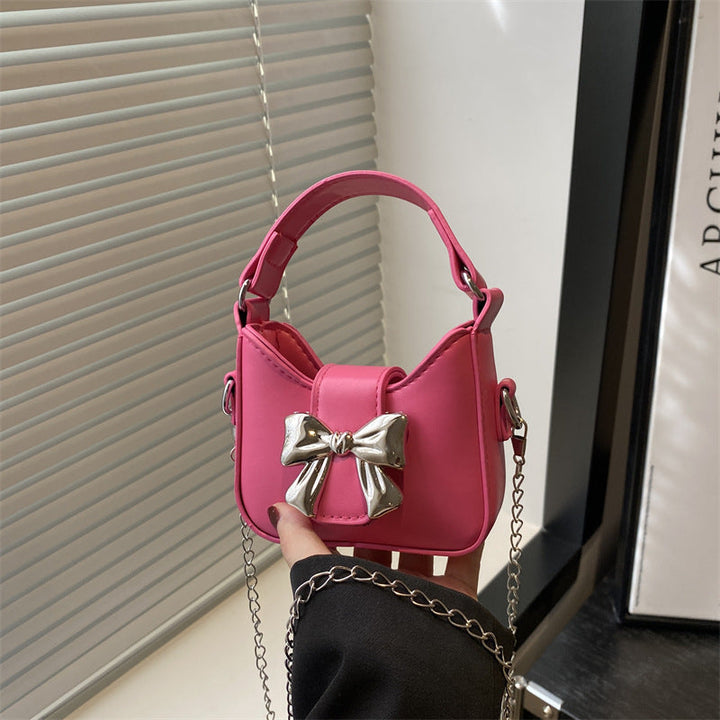 Women’s mini handbag with stylish bow closure