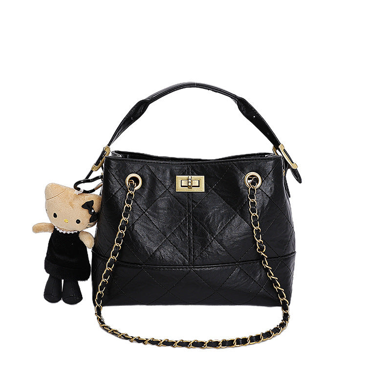 Women's shoulder bag with elegant chain accent and cute pendant