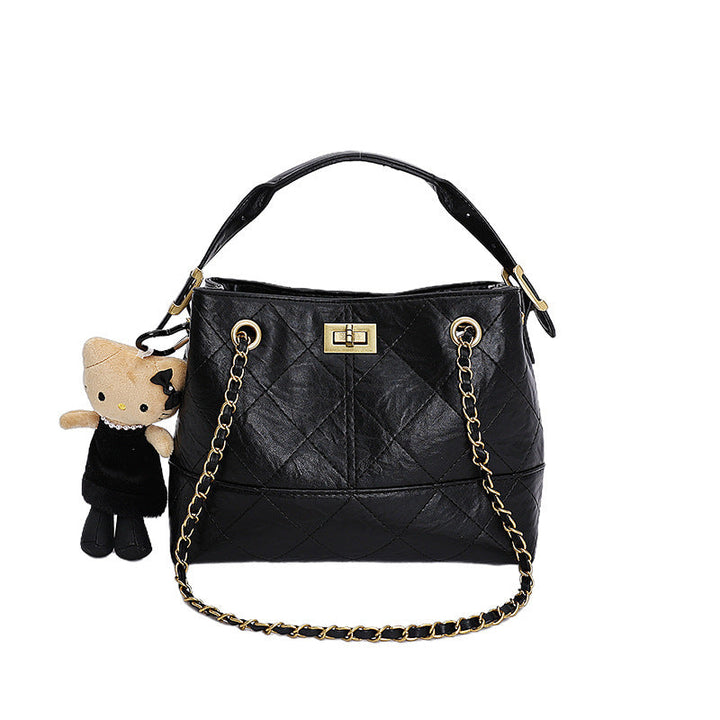 Women's shoulder bag with elegant chain accent and cute pendant